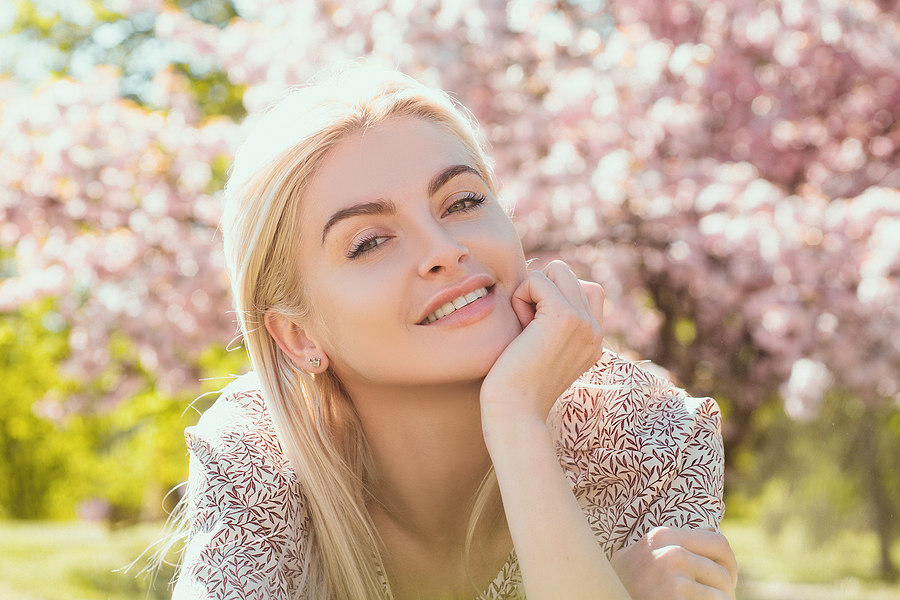 Happy-Girl-With-Flowers-laser treatment in Essex